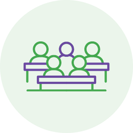 Group of students at desks, representing student participation.